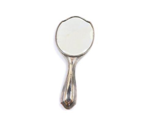 A George V silver hand mirror, with engine turned decoration, oval reserve monogram engraved, London 1911.