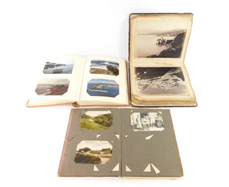 An album of Edwardian topographical and sentimental postcards and photo cards, book containing black and white photographs of