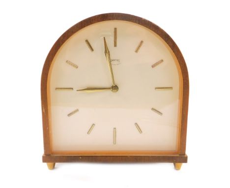 A 1950's light oak cased Smiths mantel clock, of domed form, the cream dial bearing gilt batons, twin barrel movement with co