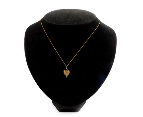 A 9ct gold pendant modelled as a fox's head, with gem set eyes, on a yellow metal neck chain, stamped 9ct, 4.3g.