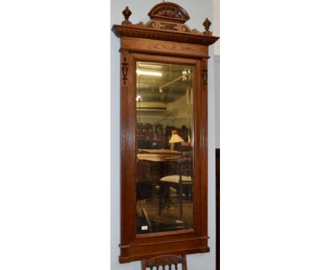 A mahogany architectural form hall mirror