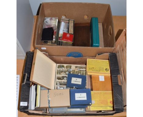 A selection of watchmaker's tools and parts consisting of watch tweezers; mainspring winder; watch/clock brass bushes; watch 