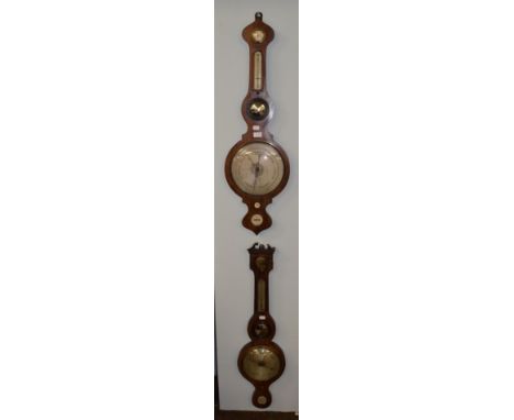 Two Victorian mahogany wheel barometers, the onion shaped pediment barometer with the spirit level dial signed W.Lane Sudbury