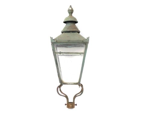A late 19thC wrought iron street lamp top, the bulbous finial top on four panelled supports with scroll cast details, 98cm hi