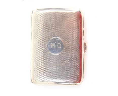 A George Vi silver cigarette case, with engine turned decoration and circular crest bearing the initials MG, Birmingham 1945,