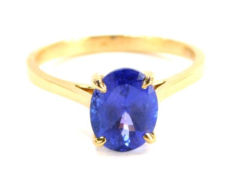 A tanzanite dress ring, with single oval tanzanite, measuring 2.02cts, grade AAA, in four claw setting with pierced design sh