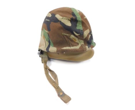 A US Army camouflage helmet.