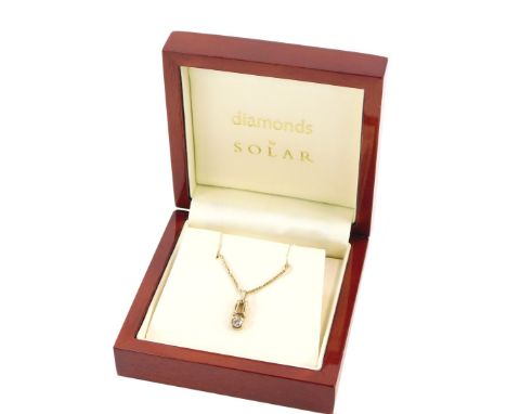 A 9ct gold Diamond by Solar pendant and chain, the diamond set pendant in rub over setting, measuring approx 0.20cts, on a fi