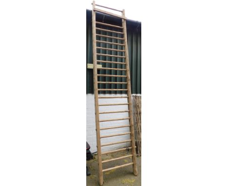 A rustic wooden rung ladder.