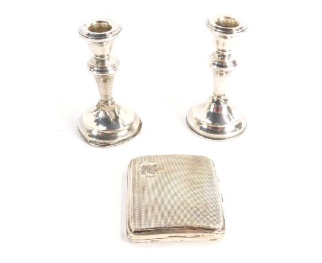 A group of silver, comprising a George V cigarette case, with engine turned front and crest with initial H, and a pair of sil