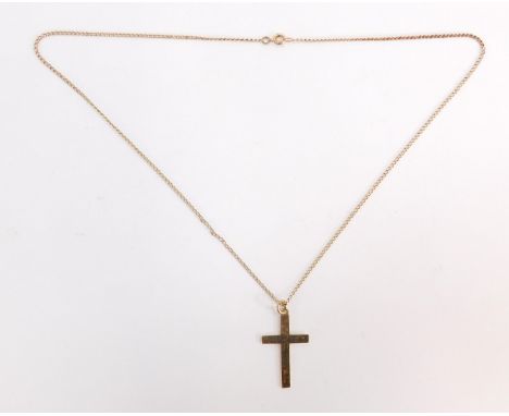 A 9ct gold crucifix pendant and chain, the crucifix of plain design, 3cm high, on a 44cm curb link chain, 3.8g.