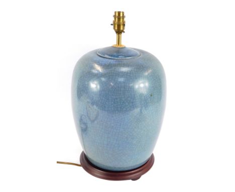 A Chinese style blue glazed domes table lamp, on a red wood base, 50cm high. WARNING! This lot contains untested or unsafe el