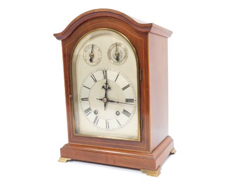 A late 19thC mahogany cased mantel clock, with arch top dial and silvered numeric chapter ring, the twenty one day movement w