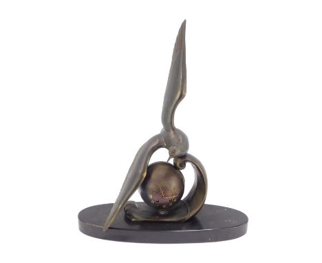 M Leducq. An Art Deco bronzed spelter mantel clock, with seagull over an orb on an oval black marble base, 64cm high, 45cm wi