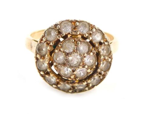 A dress ring, the circular two layered cluster set with CZs on a raised basket, yellow metal stamped 9ct, size M, 4.3g all in