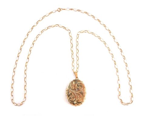 A pendant and chain, the heavy scrolled design oval pendant, yellow metal, marked 375 to clasp, on curb link neck chain, mark