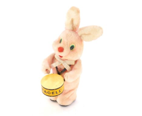 A Duracell Bunny advertising, formed as a pink rabbit playing Duracell drum, 35cm high.
