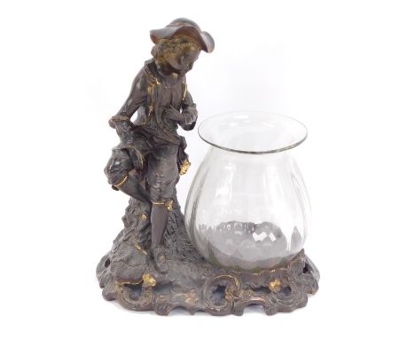 A bronzed terracotta figure of a child perched on tree trunk, looking over glass vase, with rococo scrolled base, 39cm high, 