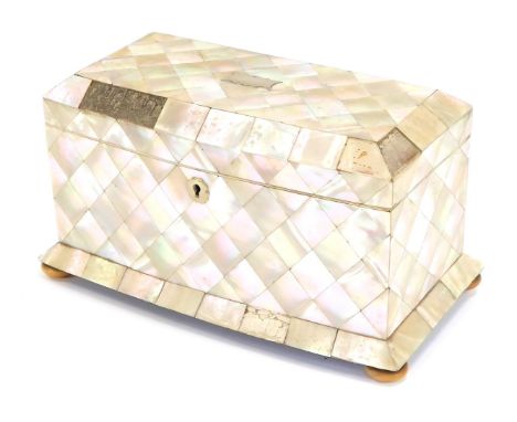 A 19thC mother of pearl inlaid tea caddy, the top with canted corners and a plated shield escuteon, on bun feet, opening to r
