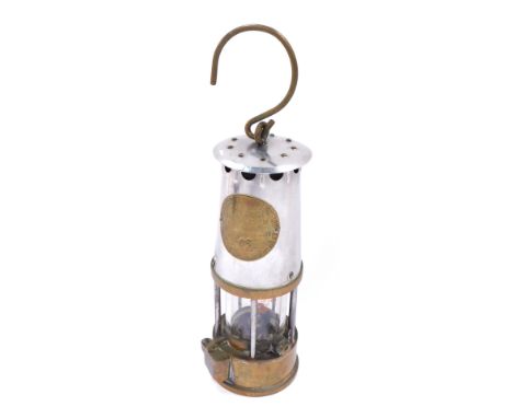 A Protector Lamp and Lighting Company miner's lamp, marked Eccles and numbered 63, with carrying handle, 23cm high.