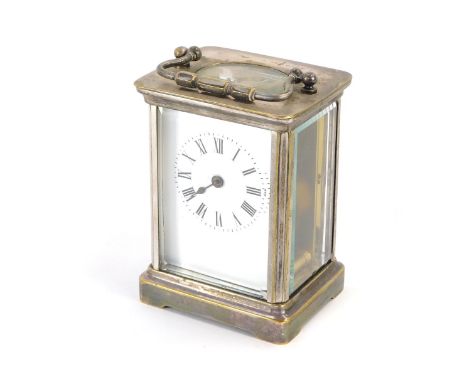 A silver plated carriage clock, the white enamel dial with Roman numeric chapter ring, with one hand, with thirty hour moveme