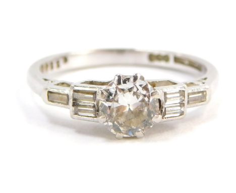 A diamond ring, with round brilliant cut diamond totalling approximately 0.46ct overall in claw setting, with three baguette 