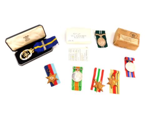 Medals and cap badges, comprising Army Emergency Reserve Medal and ribbon, cap badges, Flight Lt J L Suddaby Air Efficiency A