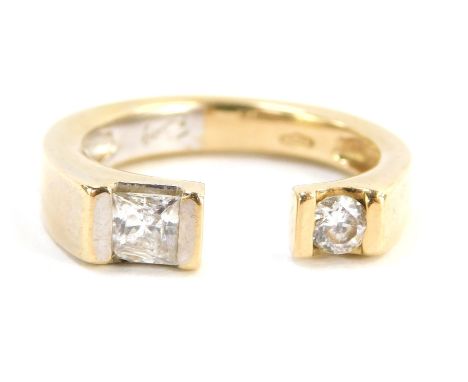 AA diamond dress ring, two torc design set with square cut and round brilliant cut diamonds, the round brilliant cut diamond 