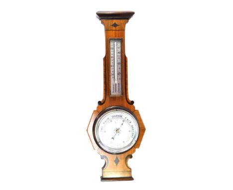 A walnut aneroid barometer, with parquetry inlay and silver dials, 55cm high, 20cm wide.