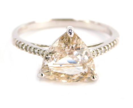 A 9ct white gold dress ring, with trilliant cut rutile pink quartz, in a raised basket setting with diamond set shoulders, ri