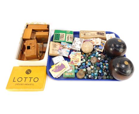 A group of vintage toys and games, comprising a pair of Taylor Roll of London carpet bowls, playing cards, wooden doll's hous