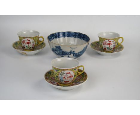 Three Chinese 20th Century, yellow ground enamel cups and saucers, red mark together with a Chinese Export blue and white slo