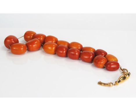 Large Baltic Amber Mala Prayer Beads on 18ct gold chain with tassel, largest bead c. 27mm, beads c. 117g, tassel c. 8.6g 