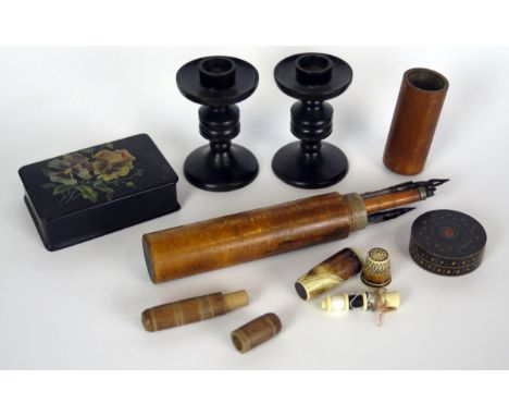 Treen, a pair of turned hardwood candles sticks, a boxwood pencil case together with a lacquered snuff box, Bakelite sewing k