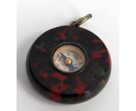 A marble compass watch fob, 2.5cm diameter. 