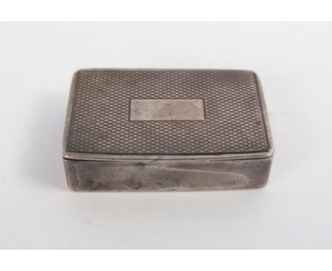 A small silver pill case, of rectangular form, engine turned,  London 1904, 3cm. 