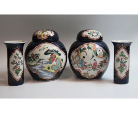 A pair of early 20th Century Sampson garniture, in the Kangxi powder blue style, comprising of a pair of ginger jars and cove