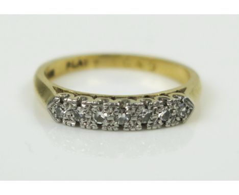 Seven Stone Diamond Ring in an 18ct gold and platinum setting, EDW 0.12ct, size I.5, 3g 