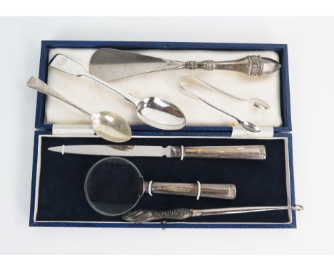 A cased paper knife and magnifying glass, together with a silver handled shoe horn, button hook, sugar nips and two teaspoons