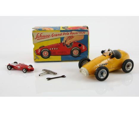 Schuco Grand Prix Racer 1070 original box with key, spanner and instructions together with a Dinky 242 Farrari.    