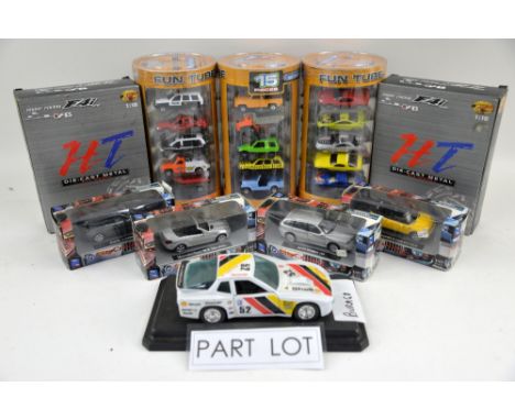 A quantity of boxed diecast models, mostly motorbikes and racing cars, including Burago and Super Racing. (qty)Provenance: Si