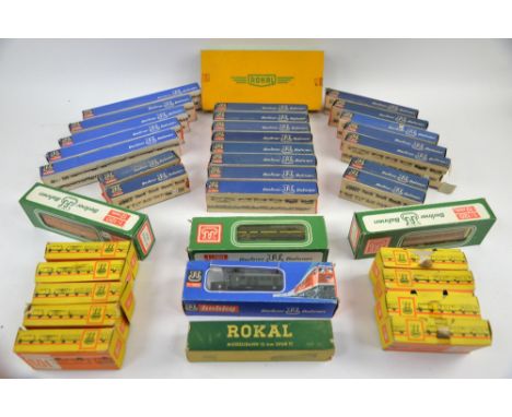 A quantity of boxed Berliner Bahnen and Rokal 12mm 1:120 scale trains, carriages and wagons. (qty)Provenance: Single owner st