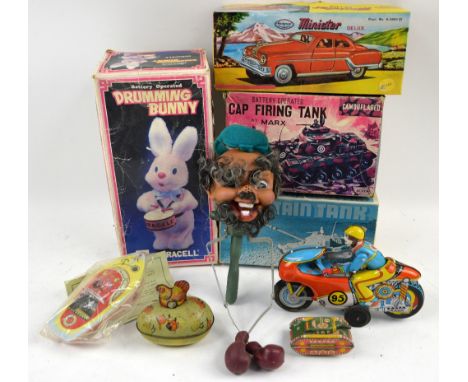 A collection of tinplate toys to include a Marx battery operated cap firing tank, a BPP Chieftain Tank, a mechanical and auto