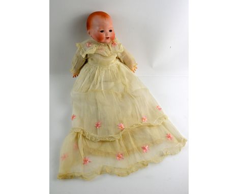 Armand Marseille ceramic head doll with sleeping eyes and open mouth, together with two smaller dolls.    