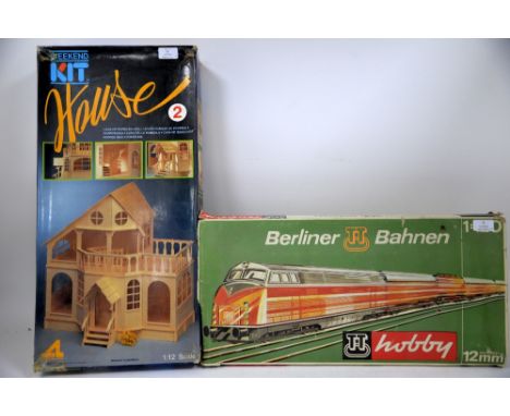 A Berliner Bahnen TT Hobby 12mm 1:120 train set and a Weekend Kit House 2 outfit, both boxed, completeness unchecked. (2)Prov