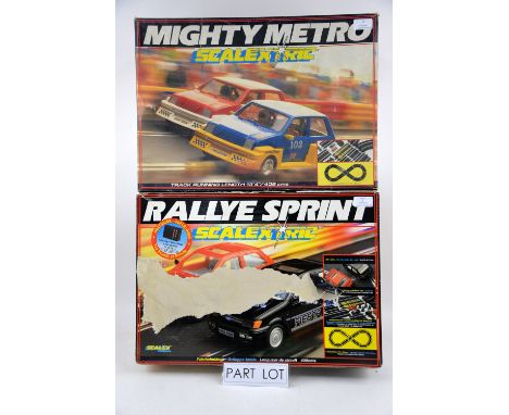 A Scalextric Rallye Sprint set C.807 and Mighty Metro racing set c.880 and a Tomy AFX Daredevil Rally outfit, all boxed, comp
