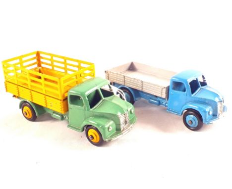 A Dinky Toys No.414 (1961-64) Dodge tipping wagon in light blue and Dinky Toys No.343 farm produce wagon in green and yellow