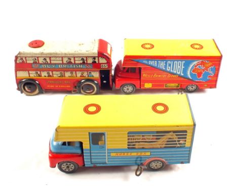 A Wells Brimtoy tin plate clockwork horse box, All Over The Globe delivery van plus a trolley bus