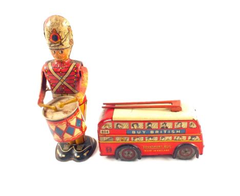 A Brimtoy clockwork trolley bust Marx tin plate drummer