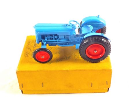 A crescent die cast Dexta tractor with steering action in a Dinky No.27A box